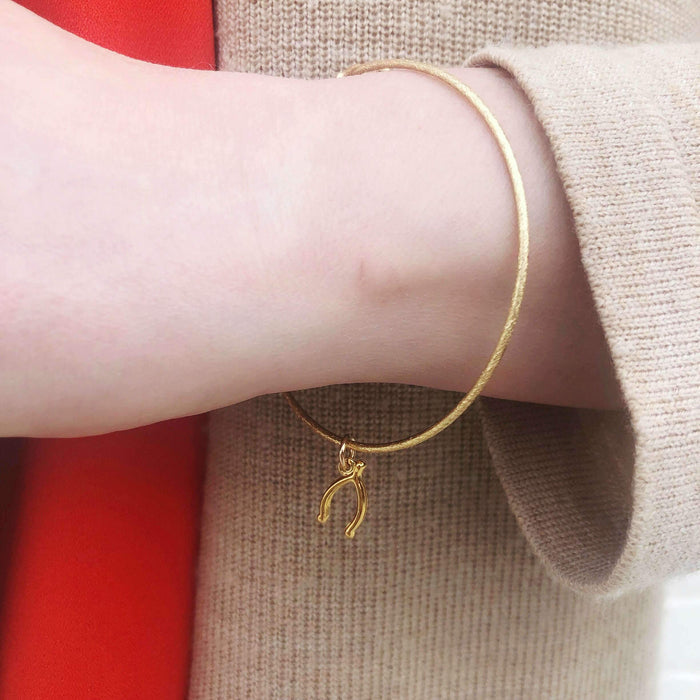 Moon and Lola - Wishbone Charm on a sleek Nora Bangle Bracelet